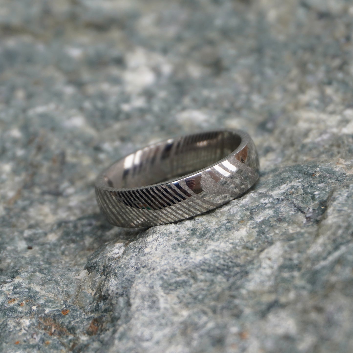 Damascus steel ring with artisan ripple design, available in sizes UK N to P by Forge and Lumber.