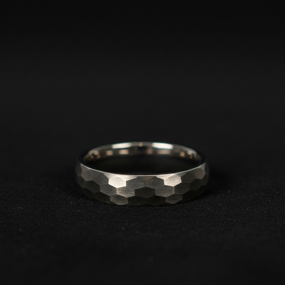 The Highlander ring: Forge and Lumber 6mm hammered titanium band.